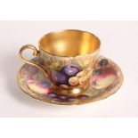 An Aynsley cabinet cup and saucer decorated hand-painted fruit with gilt interior