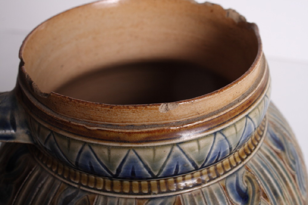 A Royal Doulton stoneware jug decorated in blue, brown and green glazes with panels of wrythen and - Image 2 of 4