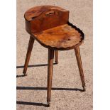 A butler's yew plate and cutlery table, on square supports fitted brass castors