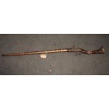 A North Indian/Afghan Jezail musket with East Indian Company lock, decorated steel barrel with