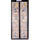 A pair of Chinese framed sleeve panels, embroidered figures amongst flowers, 22" x 4"