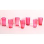 A set of seven plain ruby glass tumblers