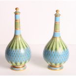 A pair of Minton bone china bottle vases and stoppers of Persian design with gilt and enamelled