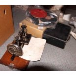 A miniature "Lead" sewing machine, a portable "Foreign" toy clockwork gramophone with records, a