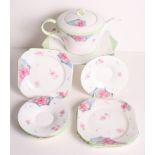 A 1930s Shelley BC teapot, pattern W12230, four matching square tea plates and a cake plate
