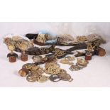 A collection of horse brasses, top swingers, martingale, etc