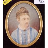 A Victorian oval miniature portrait of an unknown lady, 4 1/2" x 3 3/4", in oval gilt metal mount
