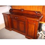 A 19th Century mahogany breakfront sideboard with low back, fitted frieze drawer and lower cupboards