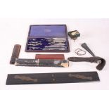 A Simplex series cased set of drawing instruments, an ebony parallel ruler, two small slide