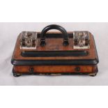 A Victorian walnut and ebonised inkstand fitted two square glass inkwells