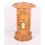 An oak hotel letter box formed as a Victorian postbox, 17" high