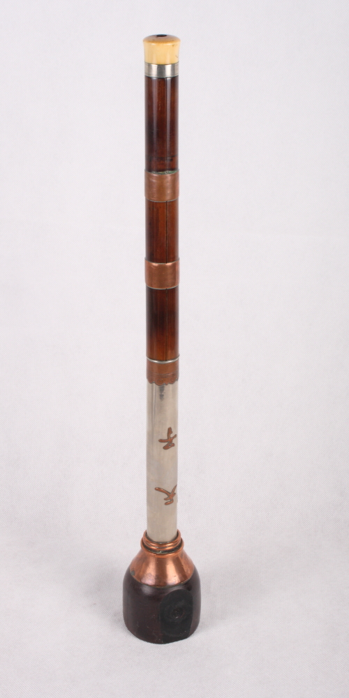 A Chinese opium pipe with copper banded bamboo and white metal stem and ivory mouthpiece, 19" long