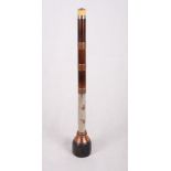 A Chinese opium pipe with copper banded bamboo and white metal stem and ivory mouthpiece, 19" long