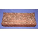 An Indian deep carved hardwood glovebox, 12" long