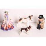 A Royal Doulton bone china figure, "Easter Day", a Winston Churchill Toby jug, a wirehaired fox