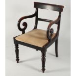 A late Regency mahogany carver chair with scroll arms, a set of three similar standard chairs and