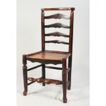 An 18th Century ladderback chair with wooden seat and turned underframe