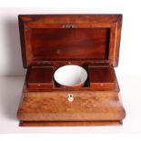 A figured mahogany bombe-shape two-division tea caddy, 14" wide