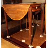 A George III crossbanded mahogany oval Pembroke table, fitted end drawer, on square taper supports