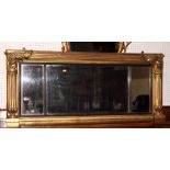 An early 19th Century three plate overmantel mirror with reeded and leaf decorated giltwood frame,