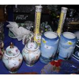 A pair of continental Dresden style bottle vases decorated alternating figure and flower panels, a