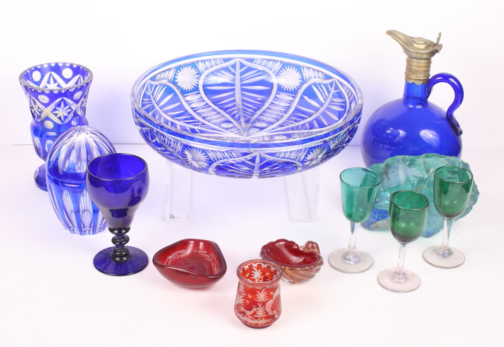 A Bohemian blue flashed crystal fruit bowl, a similar vase and jar, a blue glass flask with plated