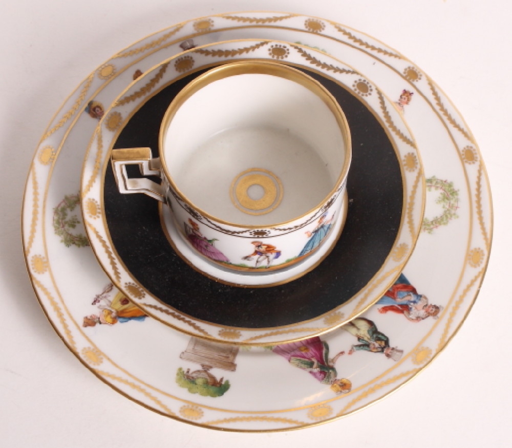 A Dresden china cabinet cup, saucer and plate decorated figures in 18th Century dress