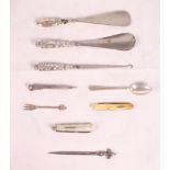 Two silver handled shoe horns, a similar button hook, a silver and mother-of-pearl fruit knife and