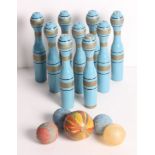 A set of nine blue painted skittles, etc