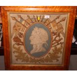 A Victorian gros point tapestry panel worked head of the Duke of Wellington surrounded by leaves and