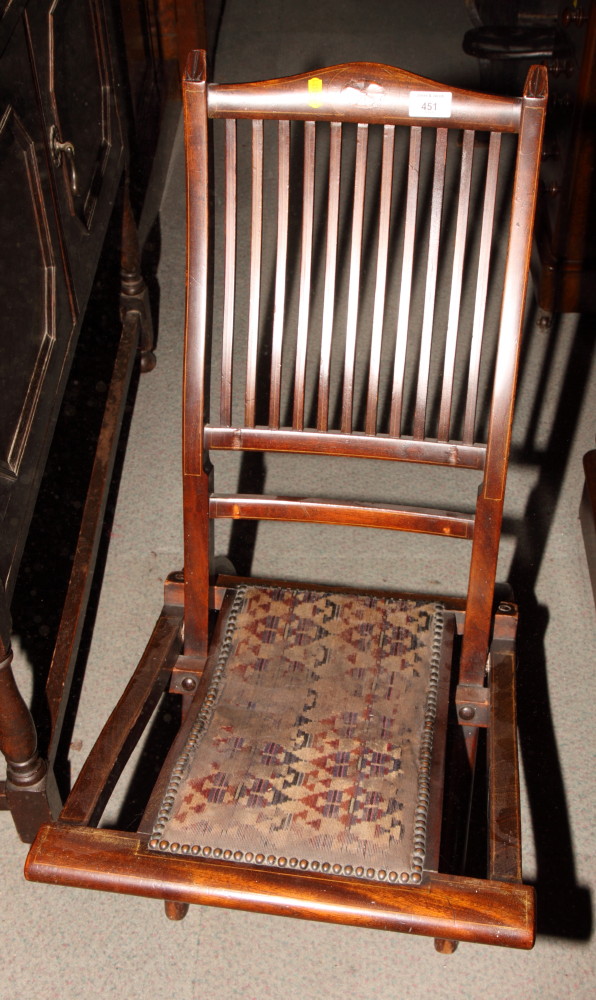 An Edwardian line inlaid mahogany folding chair, eleven square spindles to back