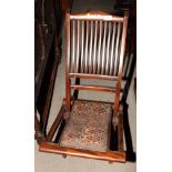 An Edwardian line inlaid mahogany folding chair, eleven square spindles to back