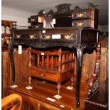 A Victorian ebonised writing table, low back fitted central mirror and four small drawers, two
