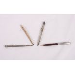 An engine turned sterling silver propelling pencil, a similar rolled gold pencil and two other