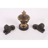 A 19th Century parcel gilt bronze pot-pourri vase on ebonised base, pierced cover with flammiform