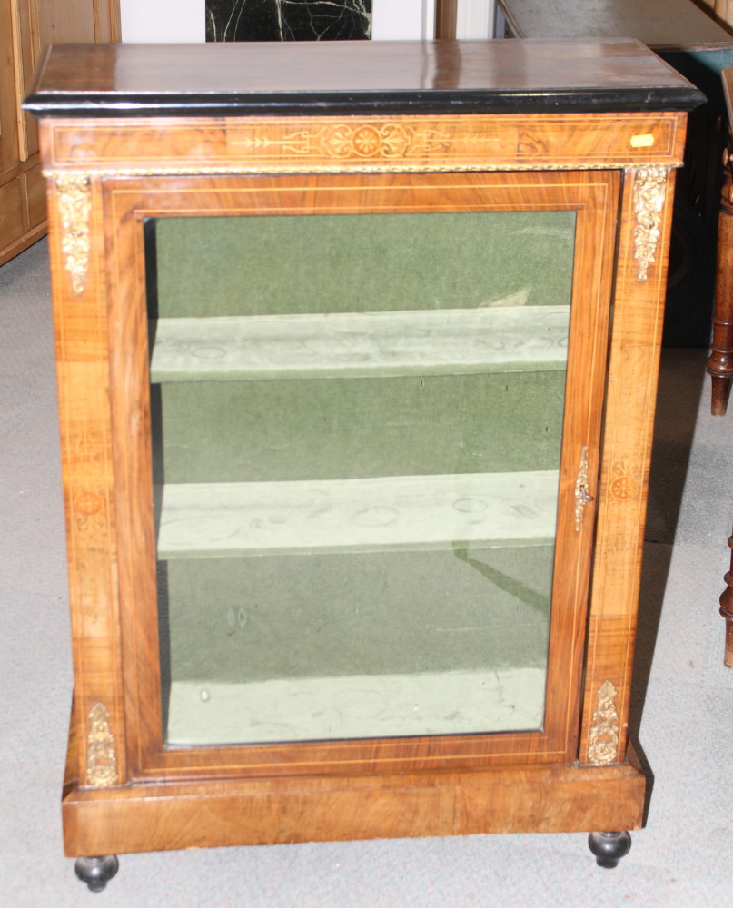 A Victorian figured walnut pier cabinet, fitted shelves enclosed glazed door, gilt metal mounts, 29"