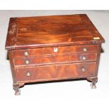 A 19th Century mahogany chest, fitted one faux drawer and two shallow drawers, on ball and claw