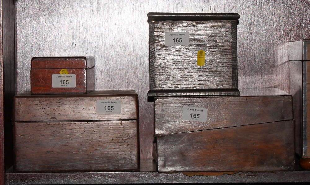 A 19th Century mahogany travelling writing desk, a rosewood workbox, an oak box and a moneybox