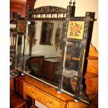A Victorian Aesthetic ebonised and gilt decorated overmantel mirror inset two floral painted gilt