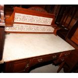 A Victorian walnut washstand with white marble top, fitted three drawers and cupboard, 48" wide, a