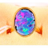 An 18ct gold signet ring set opal section