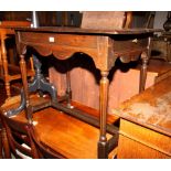 A 17th Century oak side table, fitted two end drawers, on octagonal tapering supports, 34" wide