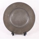 A late 17th Century broad rim pewter charger, 15" dia