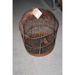 A dome top metal birdcage