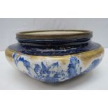 A Doulton Burslem blue and white bowl with metal rim, 26cm wide.