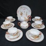 An 'Unity' tea set decorated with oriental dragons with six tea cups and saucers, six side plates