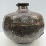 A large Eastern metal water jug/vase, diameter 33cm.