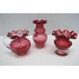 Three small Webb cranberry glass vases.