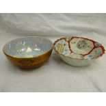 A Wiltonware lustre bowl with rouge exterior and iridescent blue interior by ACHJ of Stoke on Trent,