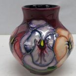 A Moorcroft pansy vase signed by 'John Moorcroft' and dated '12.4.97'; 9cm high.